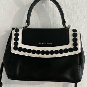 Michael Kors most adorable small purse/crossbody..black and white trim leather.